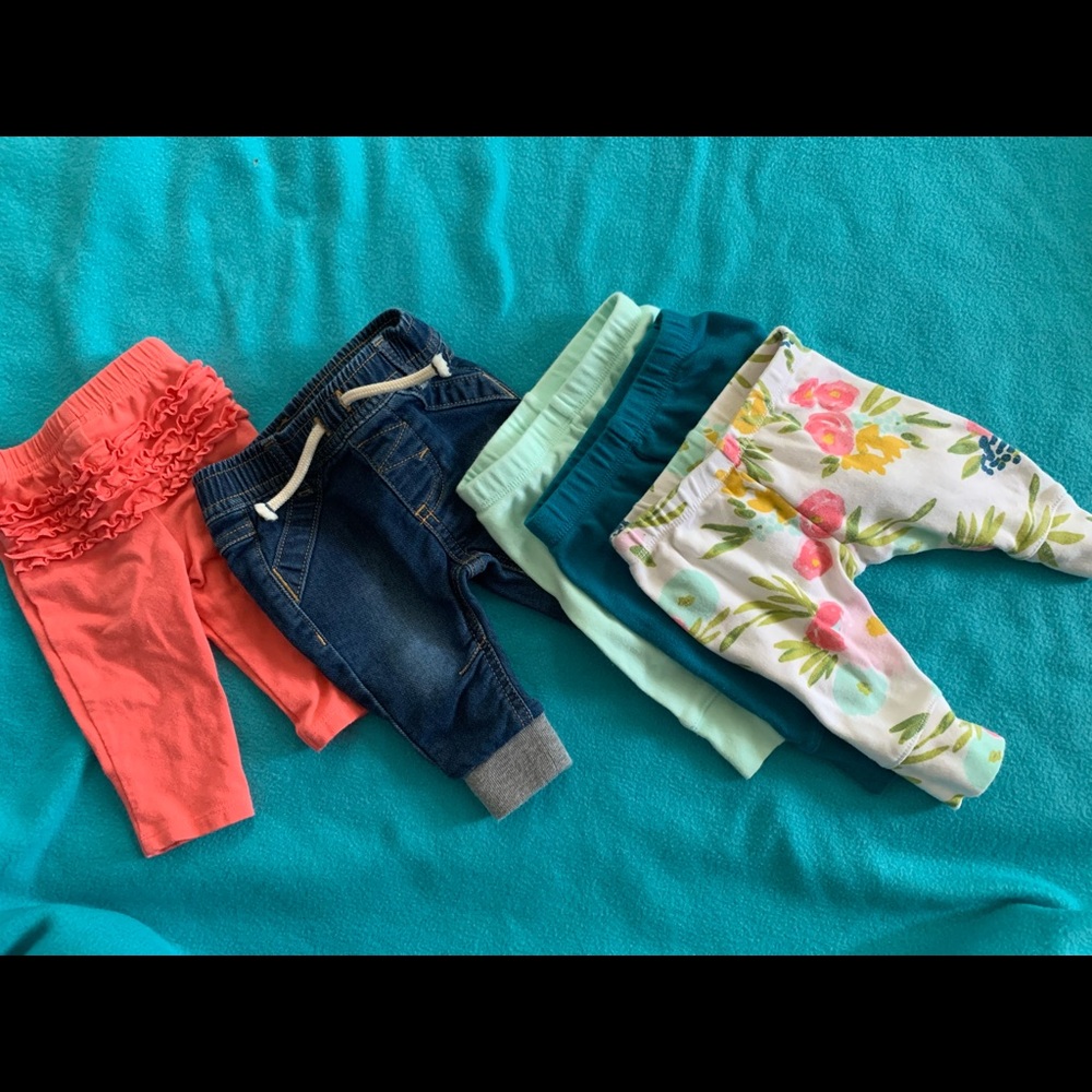 5 pair of newborn girls pants.